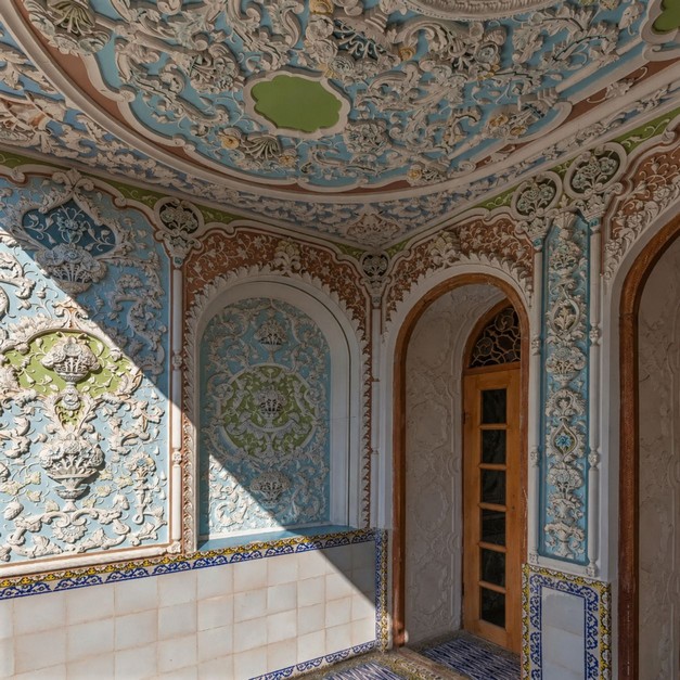 Fine stucco carvings inside the historic Narenjestan-e Qavam