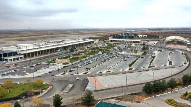Mashhad International Airport exterior with airplane
