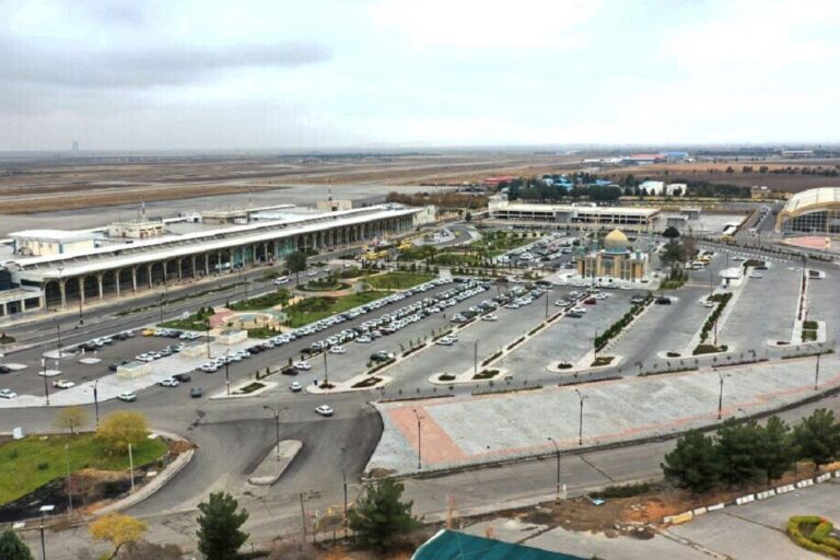 Mashhad International Airport exterior with airplane
